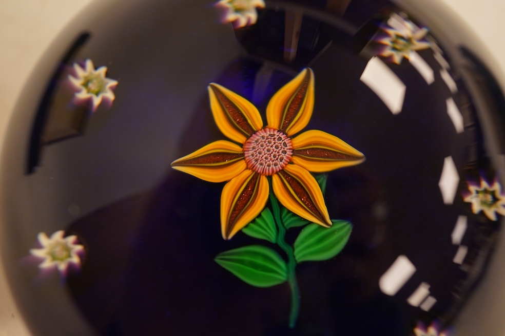 A boxed Paul Ysart floral paperweight, 7cm in diameter